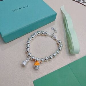 Tiffany & Co. Silver Bracelet with Orange Charm
